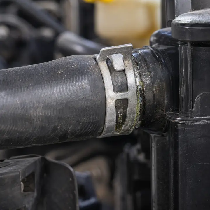 Dried coolant at a radiator hose joint