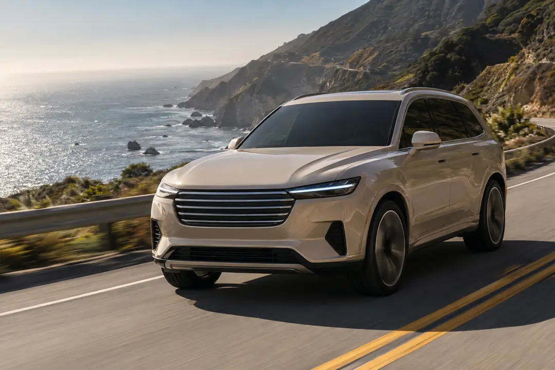 An SUV on a coastal highway above the ocean